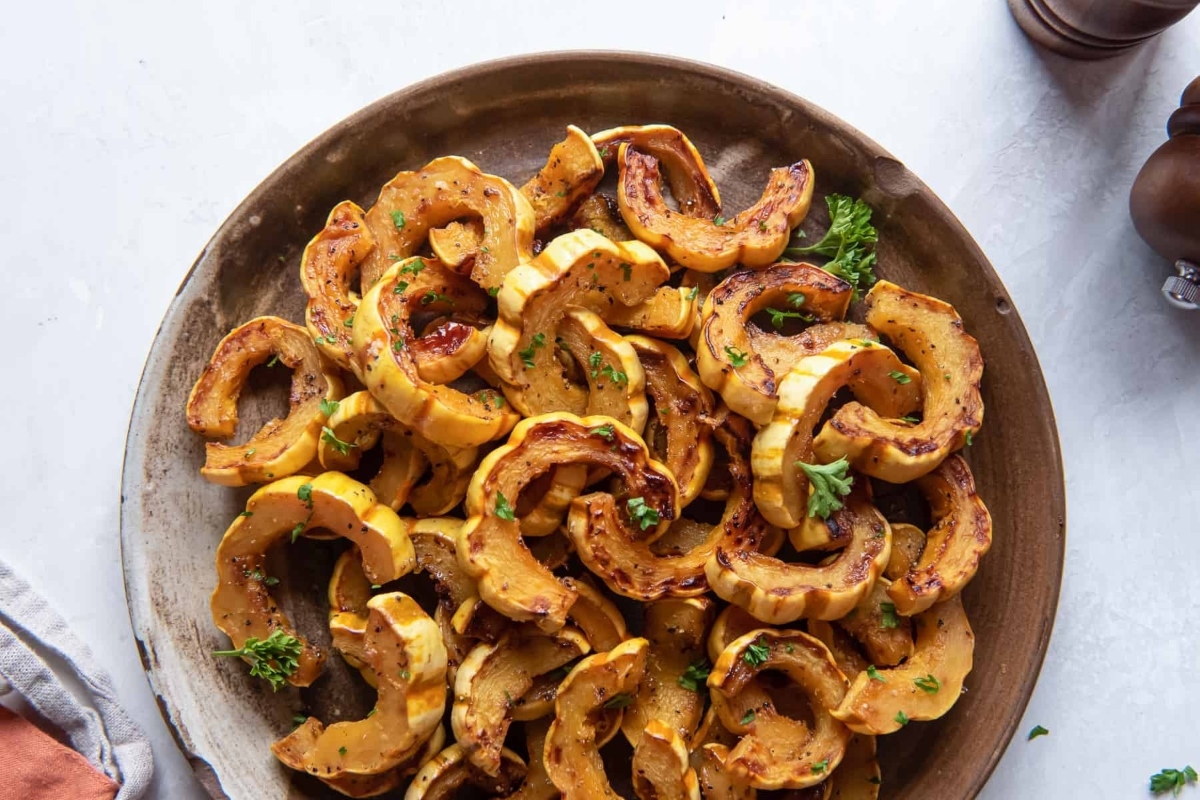 Thanksgiving Roasted squash on a plate with parsley.