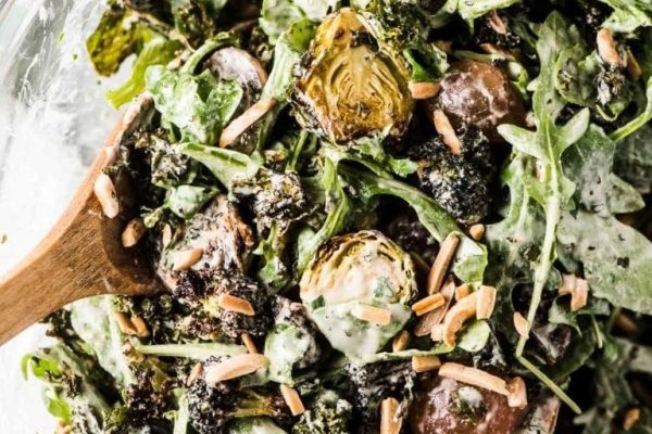 A salad with brussels sprouts and almonds.