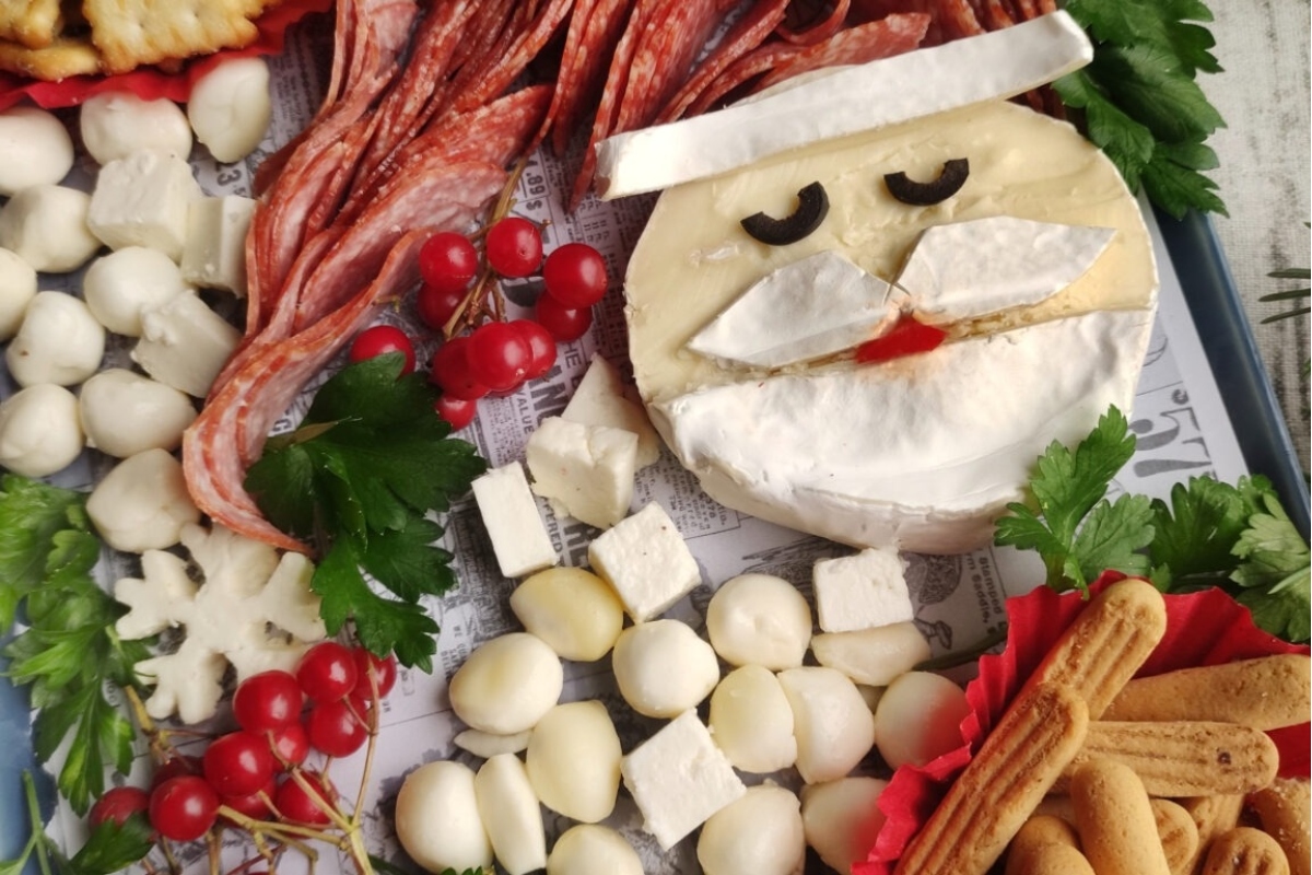 Christmas charcuterie board featuring Santa Claus cheese platter.