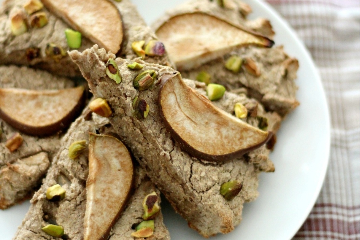 Apple scones with pistachios arranged beautifully on a plate.