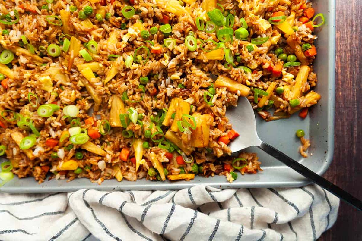 Fried rice on a baking sheet with a fork.