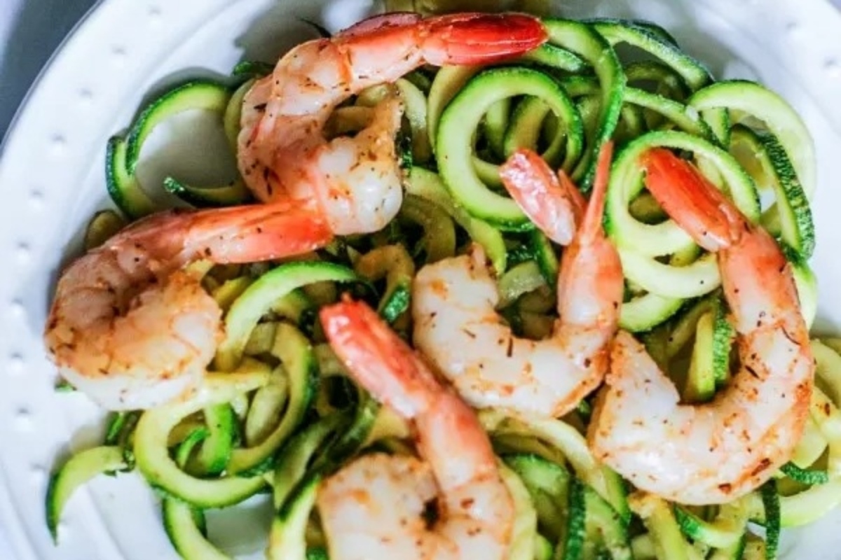 A bountiful feast featuring shrimp and zucchini, exquisitely plated for a delightful Seven Fishes celebration.