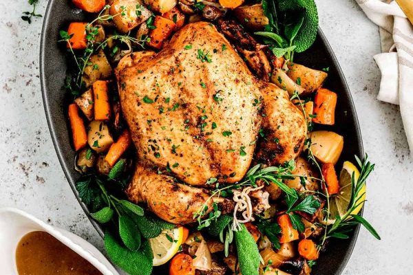 Whole chicken with vegetables.