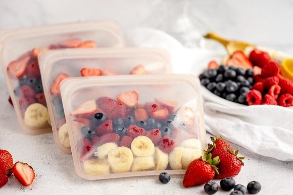 Four plastic containers with fruit and berries, perfect for Meal Prep or Breakfast.