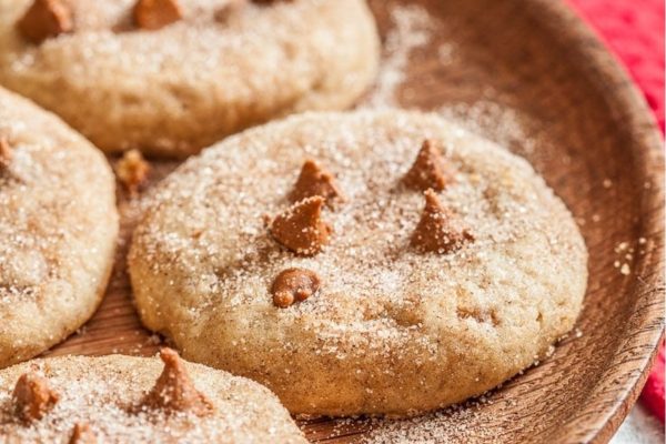 Cinnamon sugar cookies on a wooden plate.