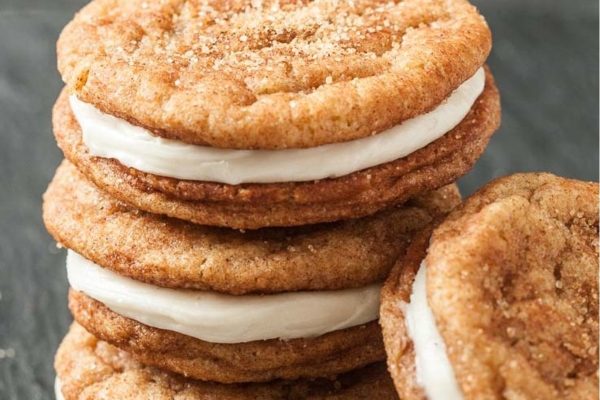 A stack of cinnamon sugar cookies with cream cheese frosting.