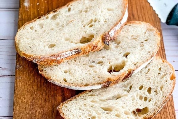 Three slices of bread on a cutting board.