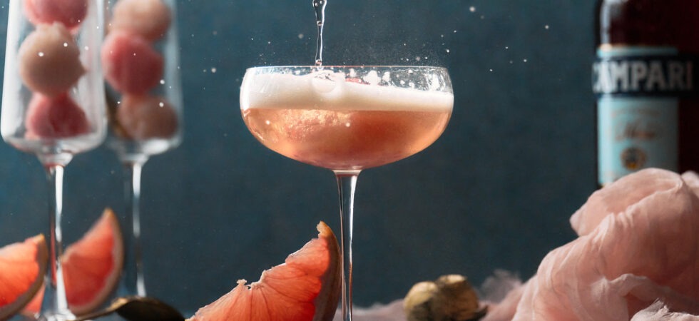A refreshing cocktail blending champagne with grapefruits.
