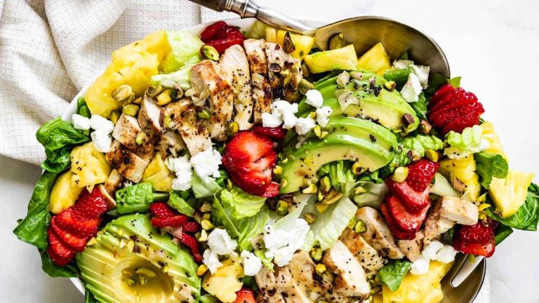 A flavorful dinner salad recipe featuring chicken, avocado, strawberries and feta.