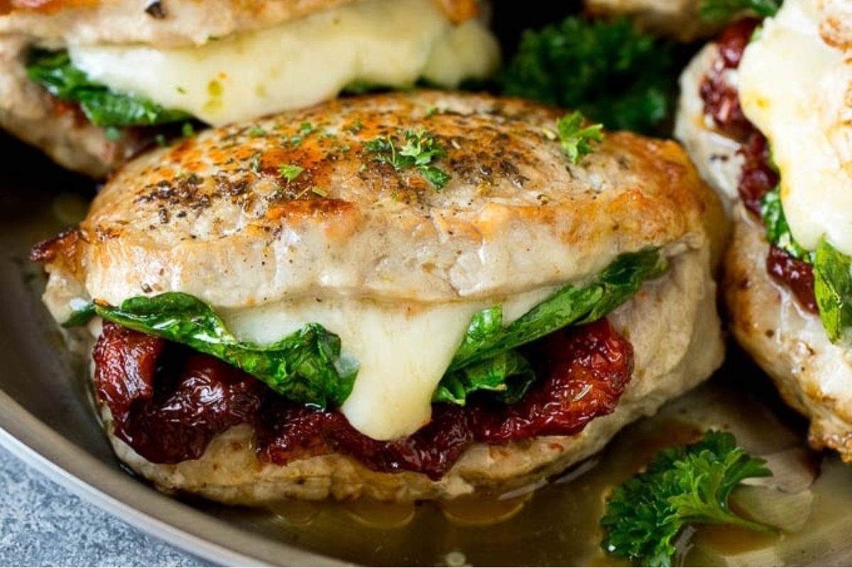 Stuffed pork chops on a plate.