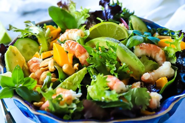 An Asian-inspired salad recipe featuring the fresh flavors of shrimp, avocado, and lime.