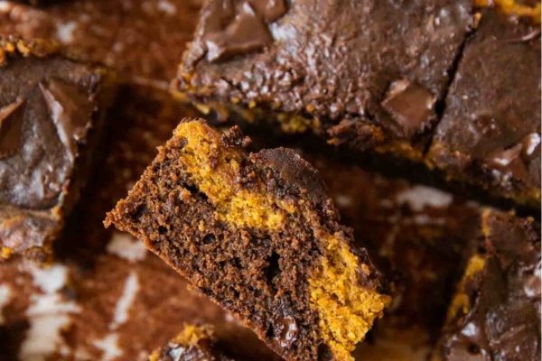 A tantalizing close up of a mouthwatering piece of chocolate brownie.