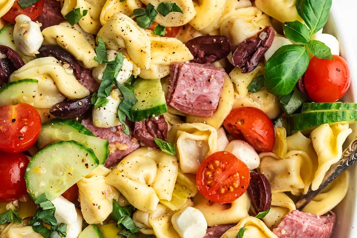 Salad: Tortellini salad with ham, tomatoes, and cucumbers.