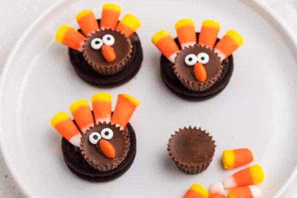 Thanksgiving oreo turkeys on a white plate.