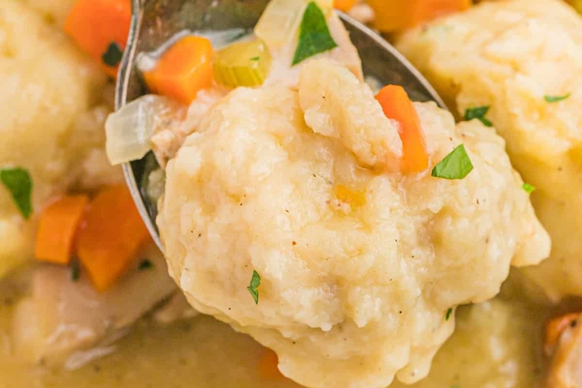 Leftover turkey dumplings with carrots served in a bowl.
