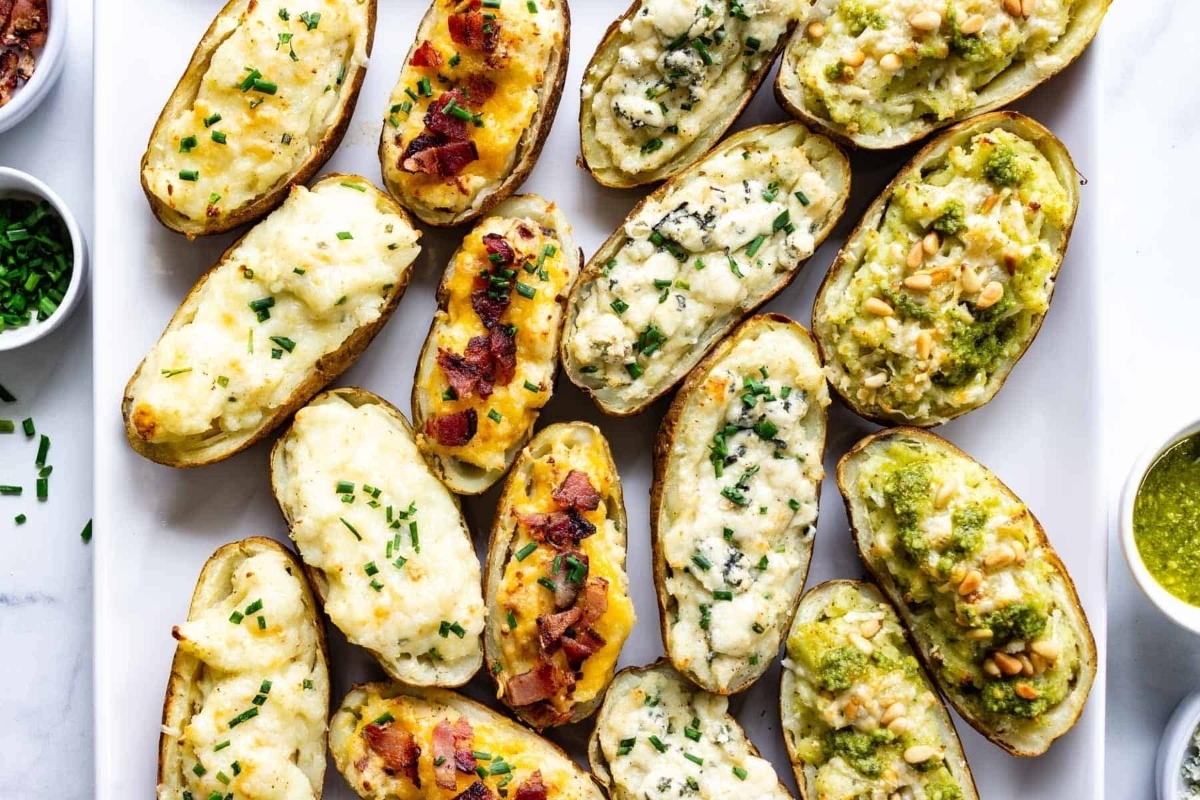 Cheesy potato wedges on a white plate.