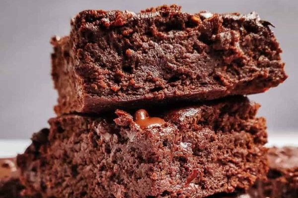 A stack of chocolate brownies, showcasing delicious layers of moist goodness.