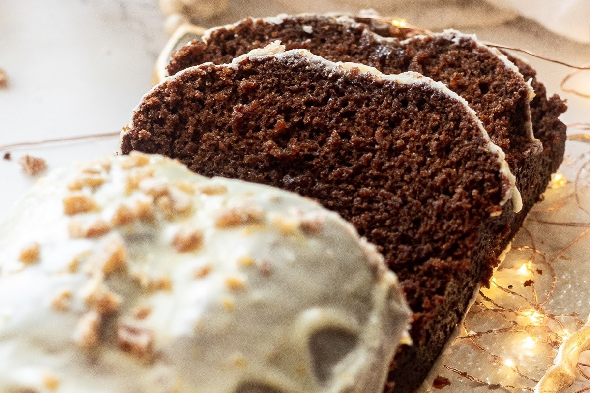 A slice of chocolate cake with gingerbread icing on top.