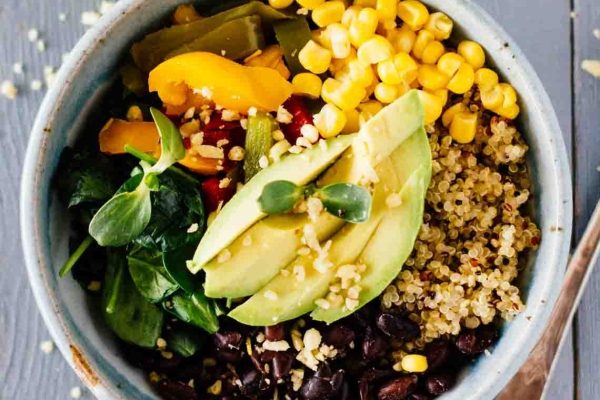 A delicious and nutritious meal prep option for lunches - a bowl of quinoa, black beans, corn and avocado.