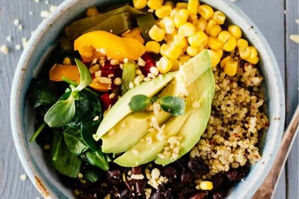 Quinoa bowl with black beans, corn and avocado.