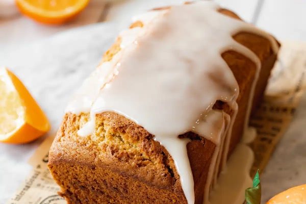 A zesty orange bread recipe, featuring a delectable icing topping.
