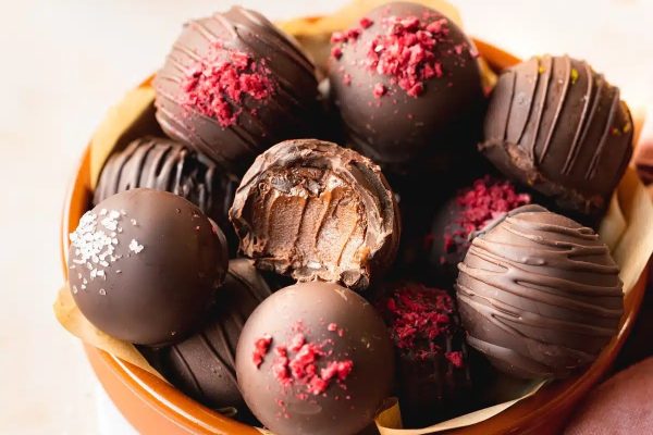 Christmas chocolate truffles in a bowl on a table.