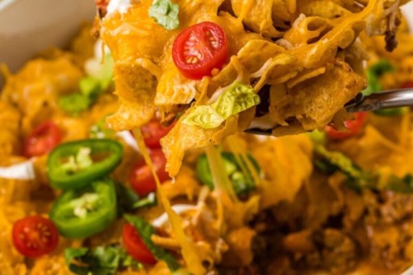 Taco nachos in a white bowl.