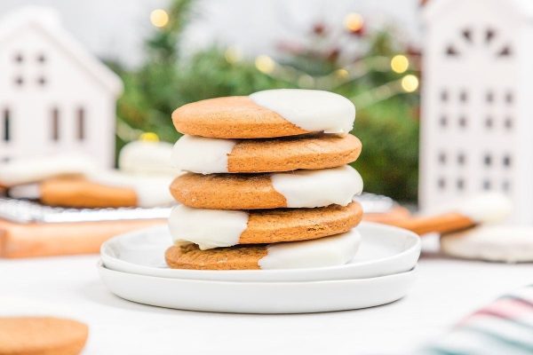A stack of ginger cookies with icing on top.