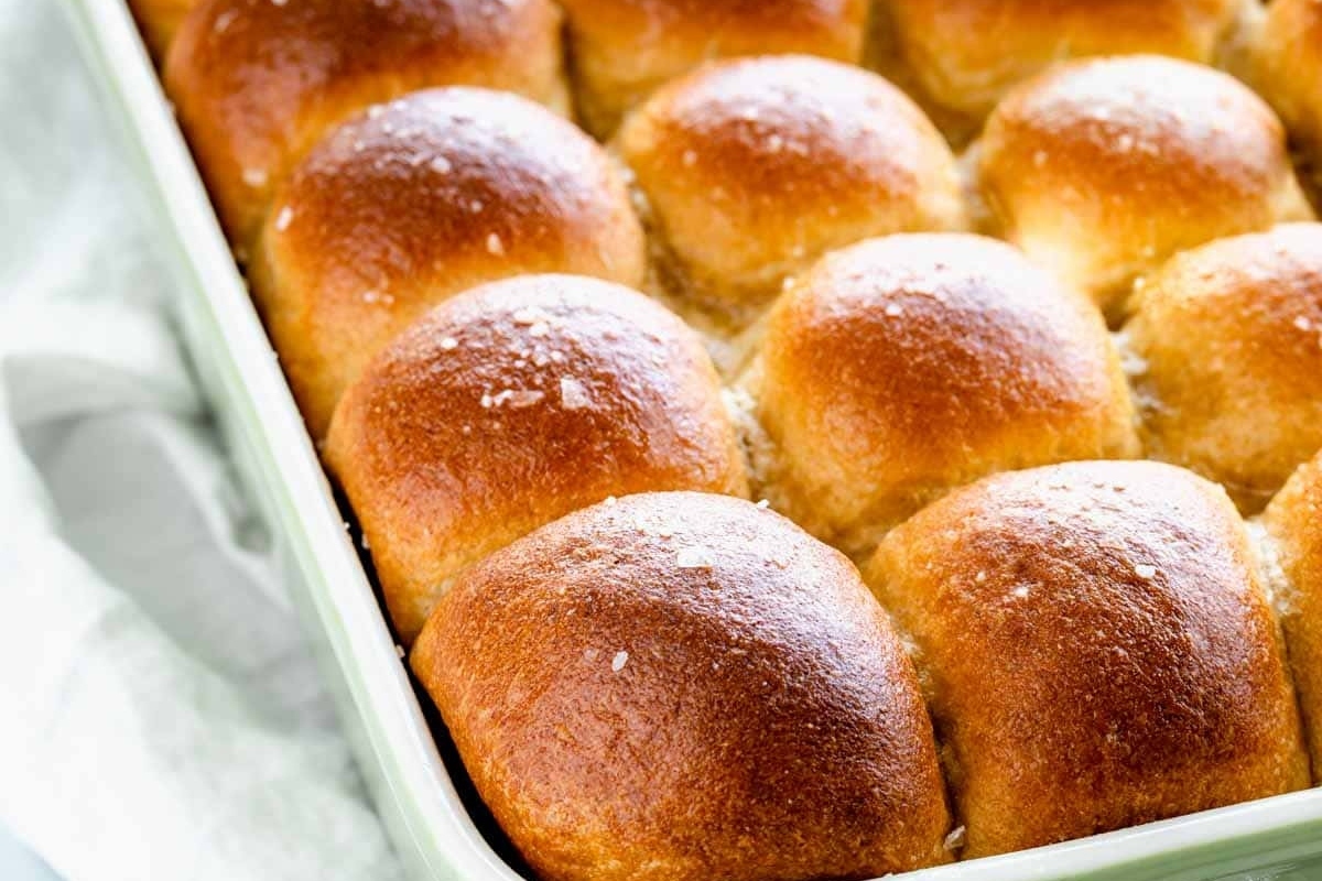 Make-ahead bread rolls in a green baking dish.