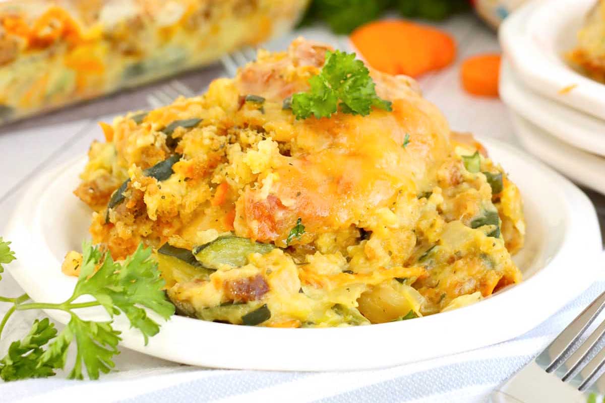 A casserole dish with meat and vegetables in it.