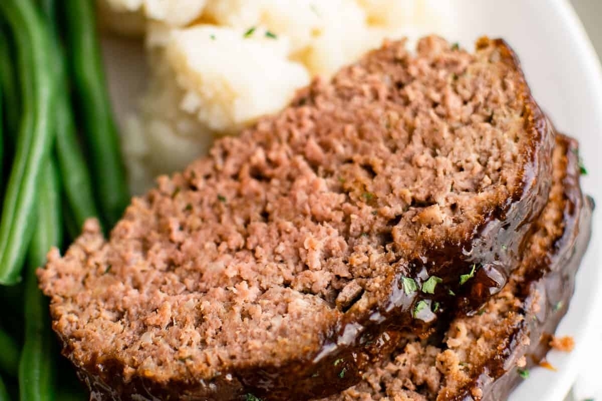 Winter comfort food - Meatloaf served with green beans and mashed potatoes, cooked to perfection in an air fryer.