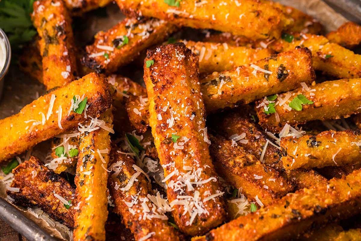 Roasted sweet potato fries topped with parmesan cheese and parsley.