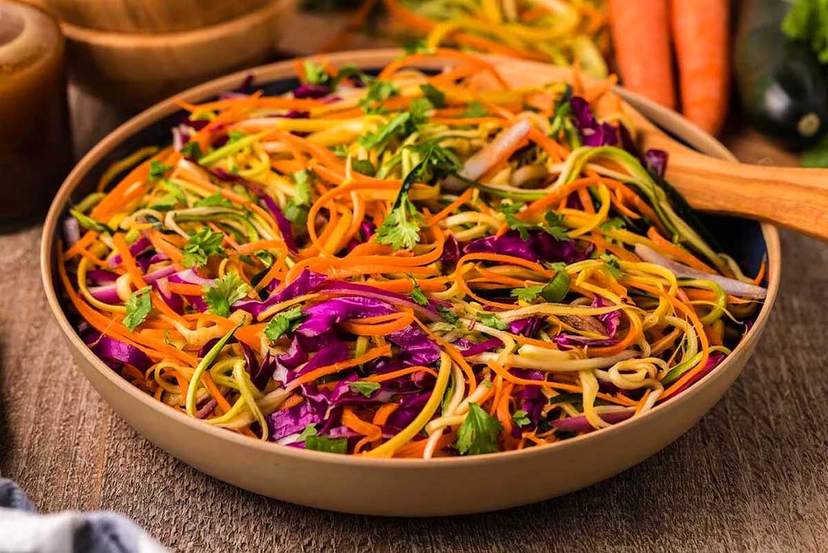 A bowl of slaw with cabbage.