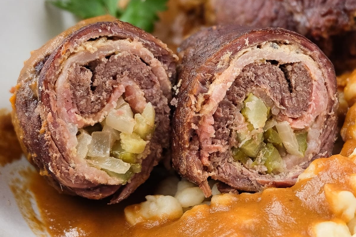 A traditional German recipe featuring a hearty plate of meat and vegetables, elegantly presented on a white plate.