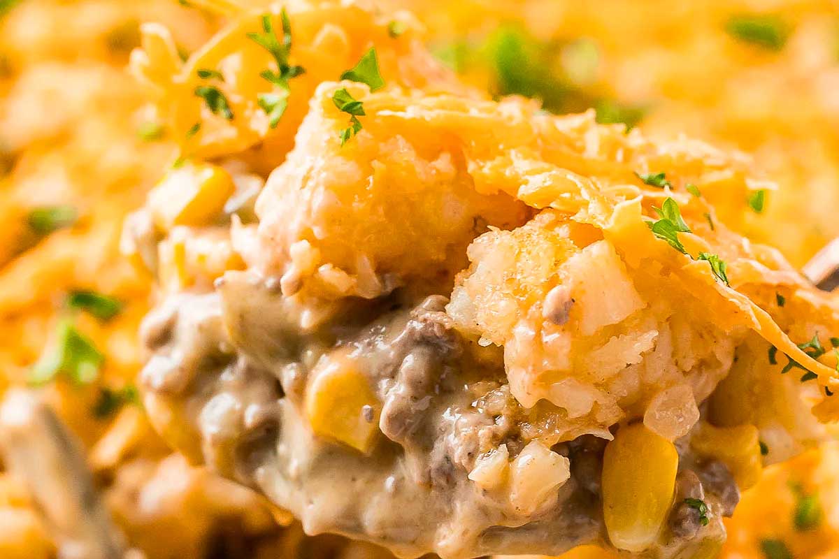 A spoonful of cheesy corn casserole.