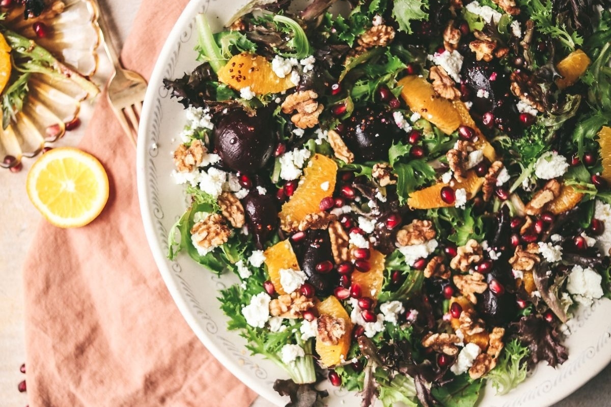 Orange pomegranate salad with walnuts and pomegranate seeds is a delightful addition to your Turkey sides.