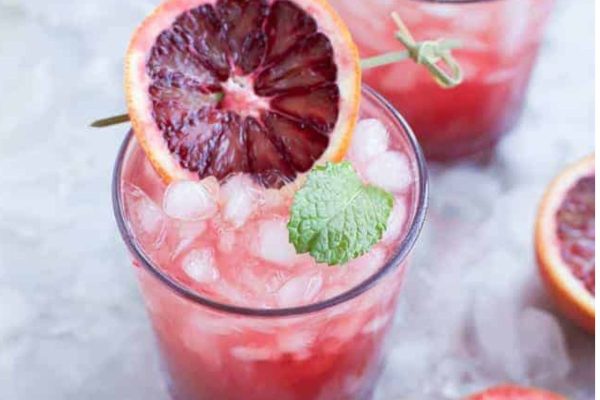 Blood orange margarita with mint leaves. Indulge in this refreshing cocktail recipe that combines the vibrant flavors of blood oranges and the aromatic touch of mint leaves.