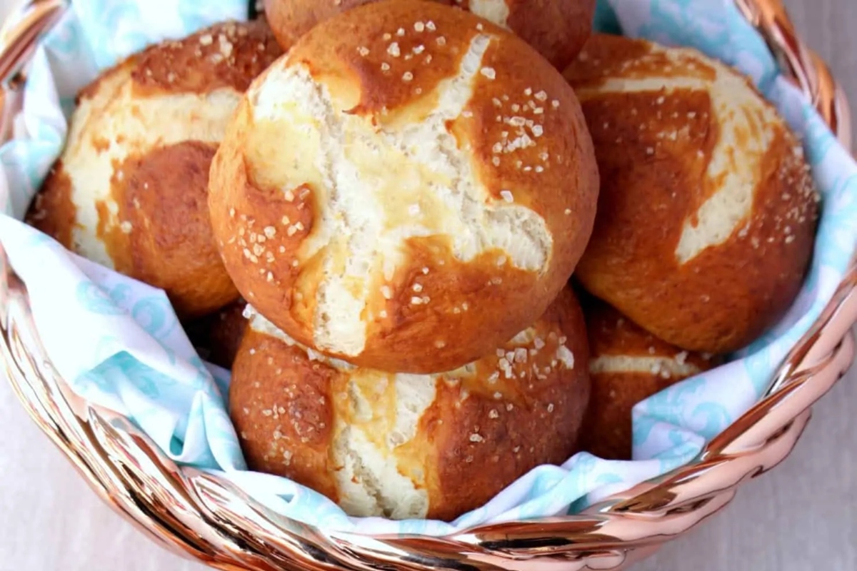 German hot cross buns in a basket on a table.