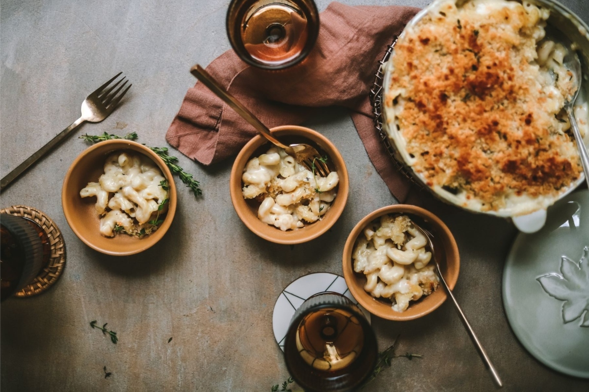 A bowl of macaroni and cheese recipes on a table.