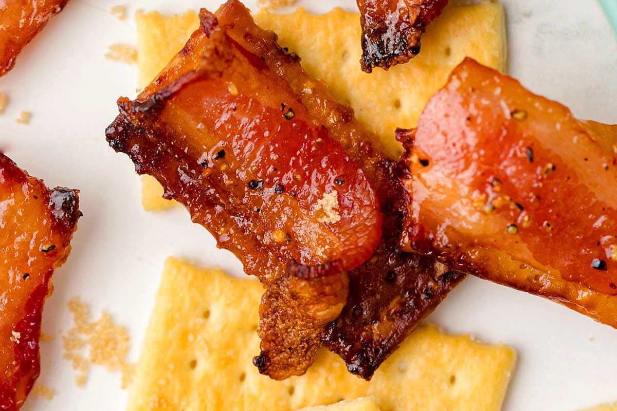 Bacon and crackers on a plate.
