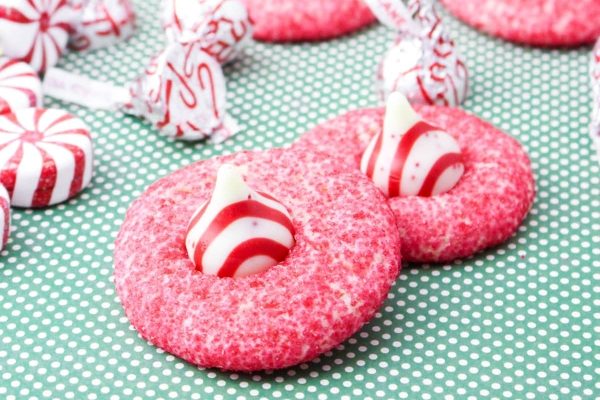 Candy cane cookies on a polka dot background.