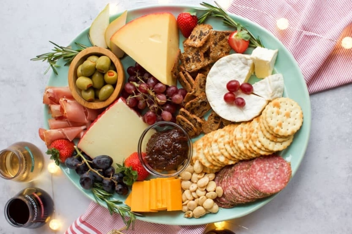 A delicious spread of cheese, crackers, grapes, and nuts perfect for New Year's Eve or any appetizer occasion.