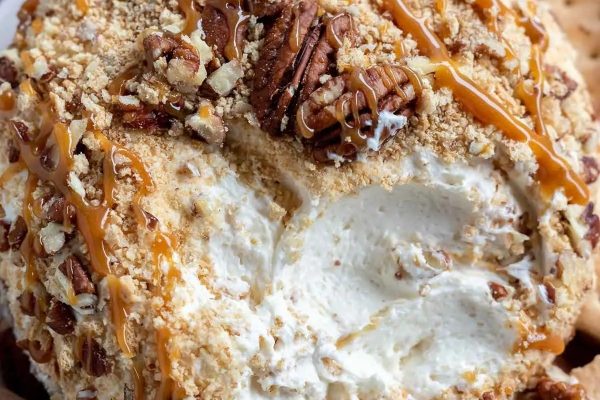 A delectable ice cream ball coated in rich caramel and crunchy pecans.