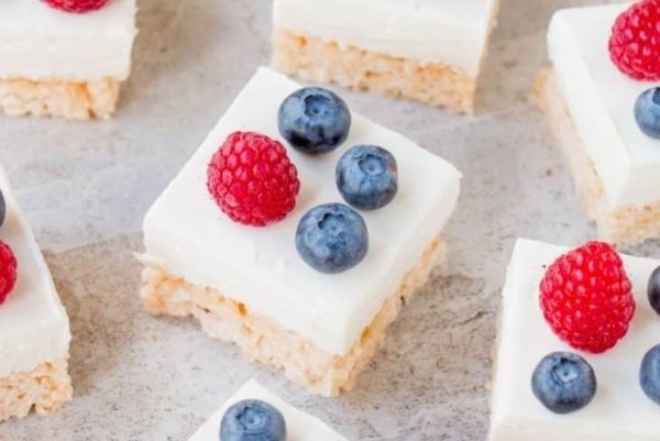 Rice krispie squares with blueberries and raspberries.