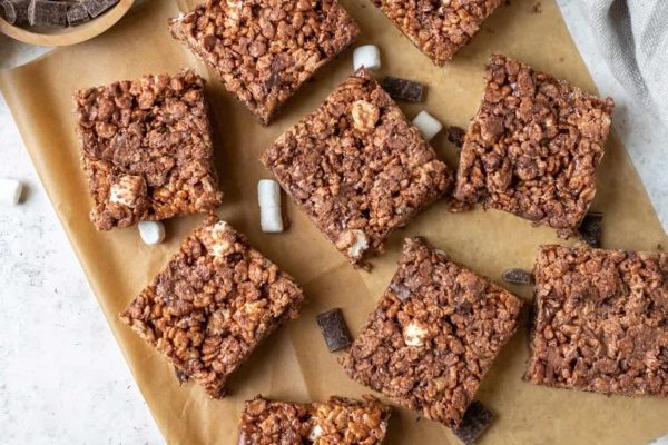 Chocolate rice krispies on a baking sheet.