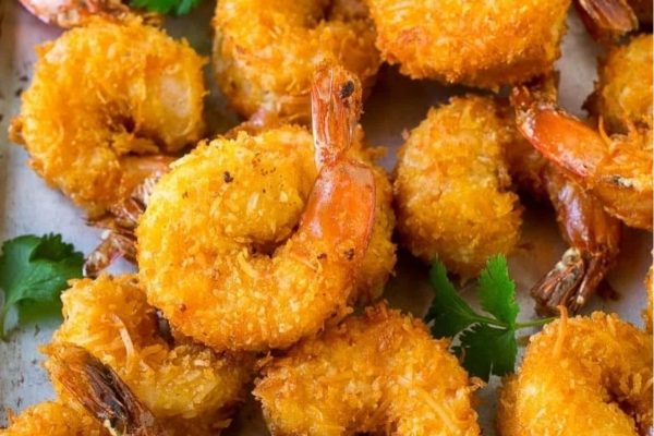Fried coconut shrimp on a baking sheet.