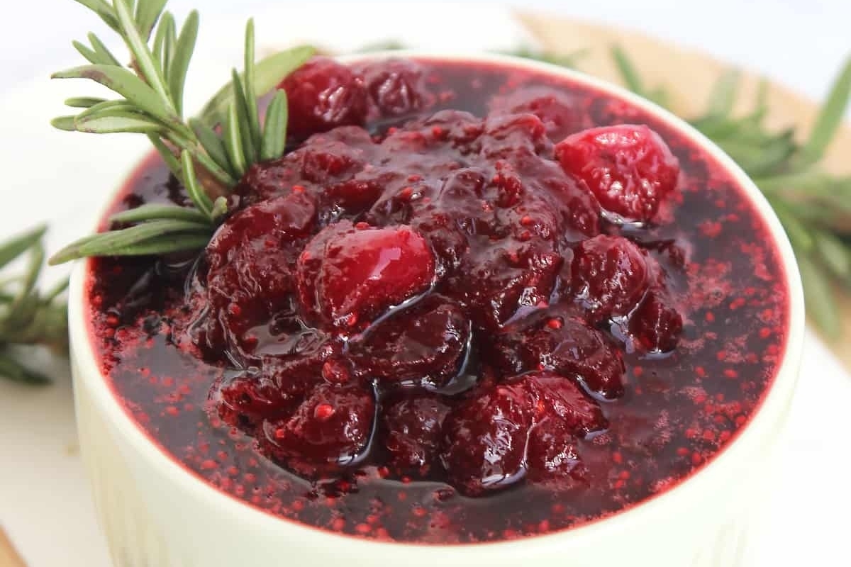A cranberry sauce recipe enhanced with rosemary sprigs.