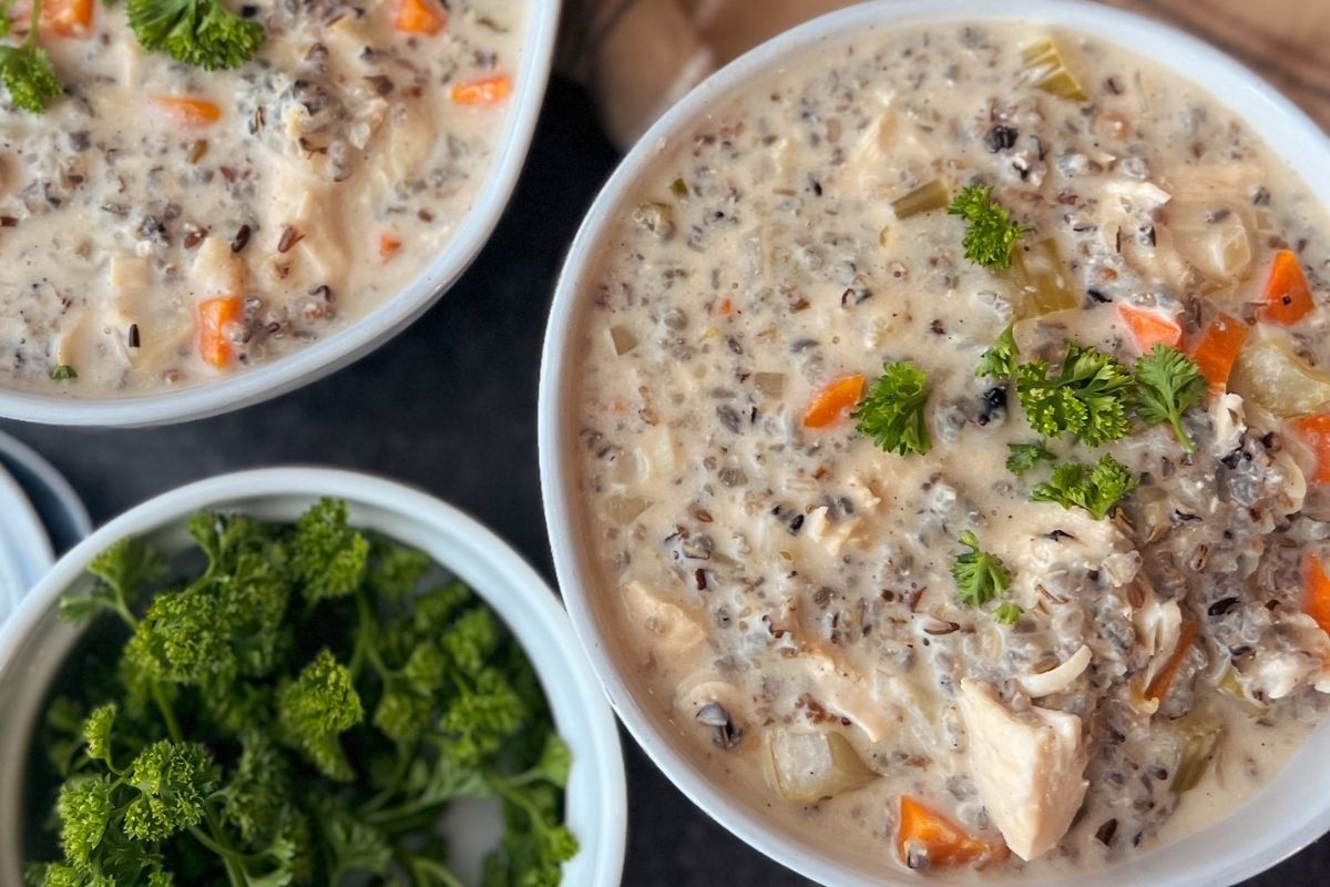 Two comforting bowls of chicken and rice soup, perfect for cozy winter dinners.