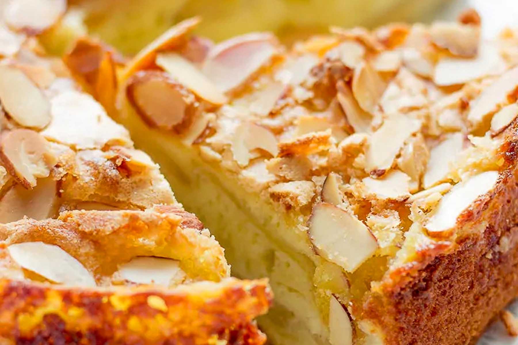A slice of almond cake on a plate.