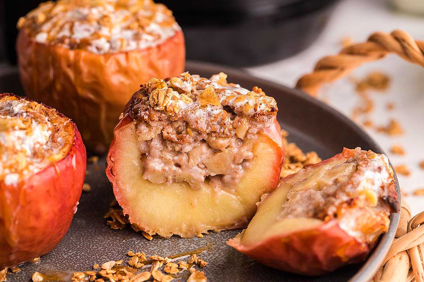 Apples stuffed with granola on a plate. This is one of the best apple recipes.